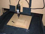 Mill cutting the word SUPER in wood