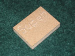 The word SUPER in wood